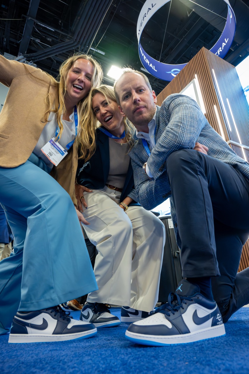 ThreePortCanaveralemployeeswithmatchingshoesposeforaphotoat2026SeatradeCruiseGlobal