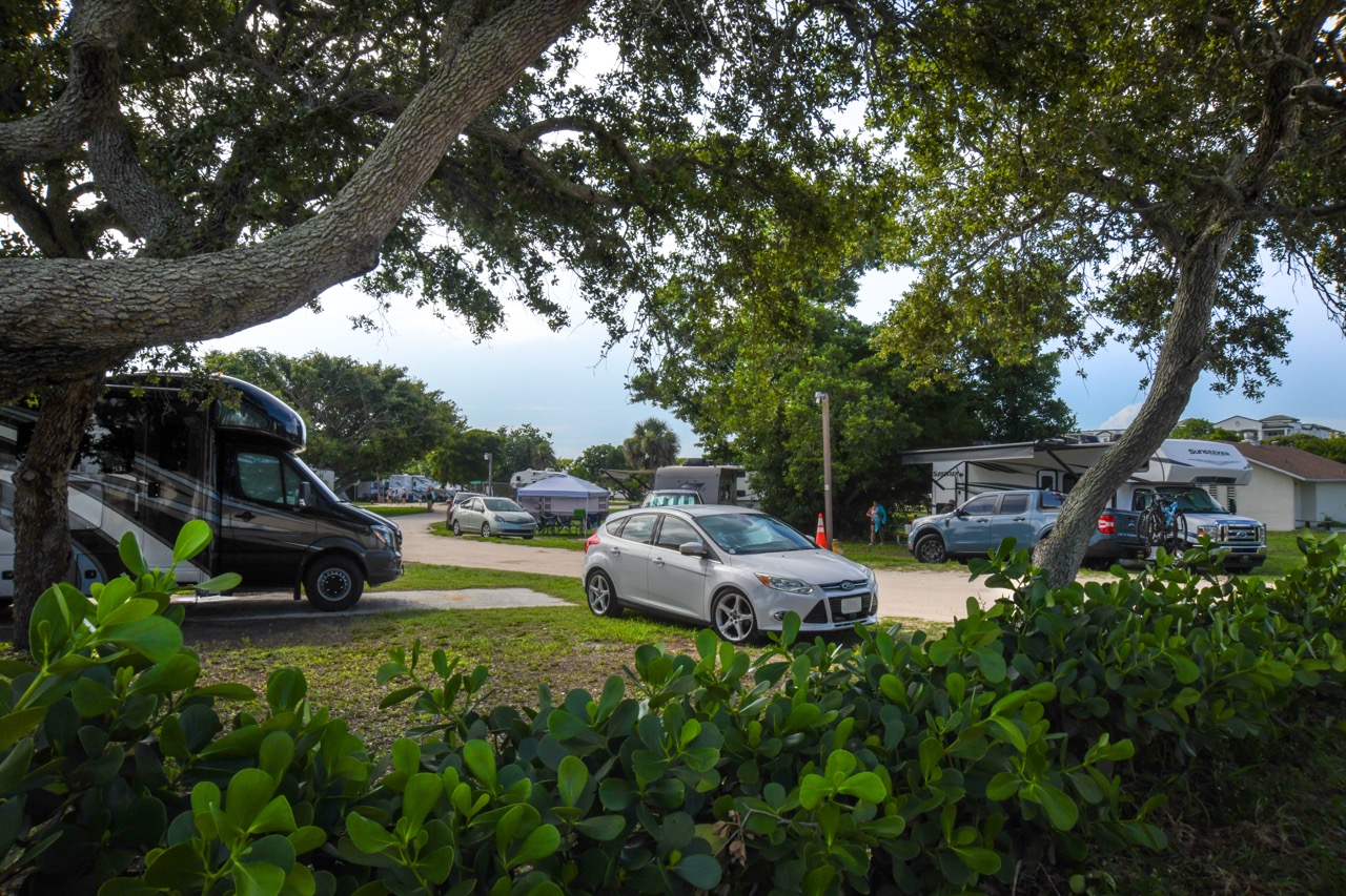 ThroughgreenfoliagetherearecampersonattheJettyParkCampground
